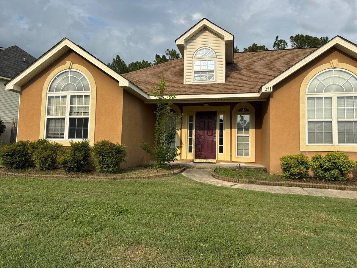 Front of the single-story home at 251 Swallow Lake Drive, North Augusta, with a covered entry and two-car garage